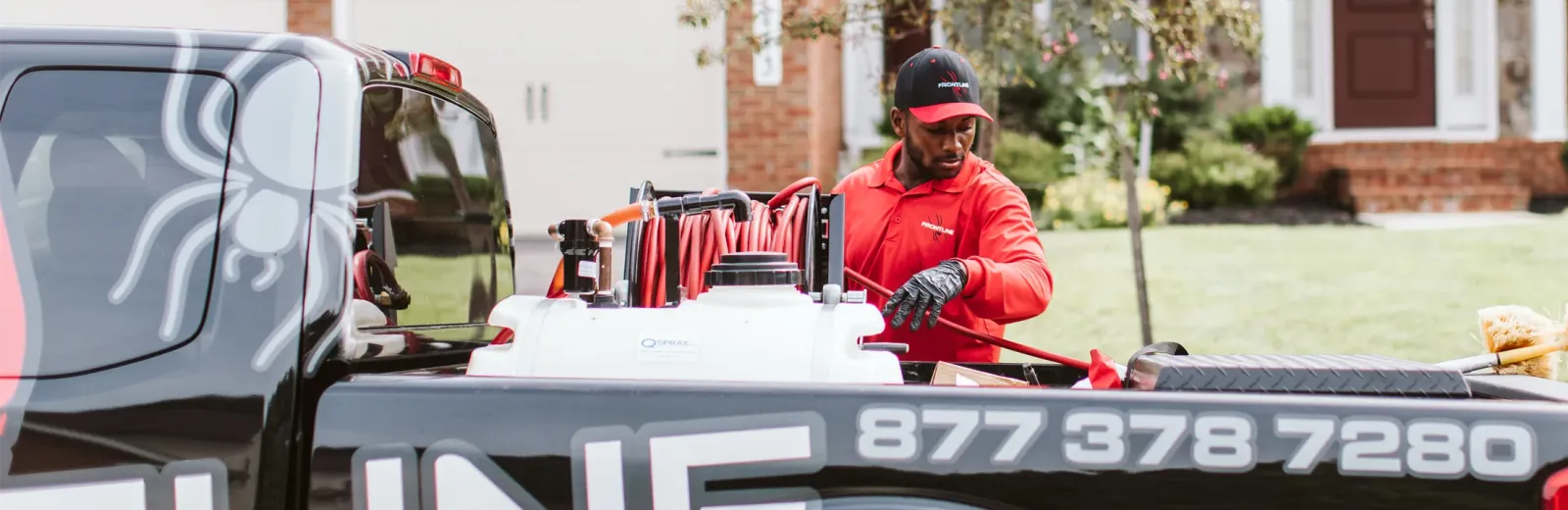 technician standing next to truck getting equipment setup