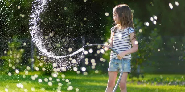 Girl playing in mosquito free yard